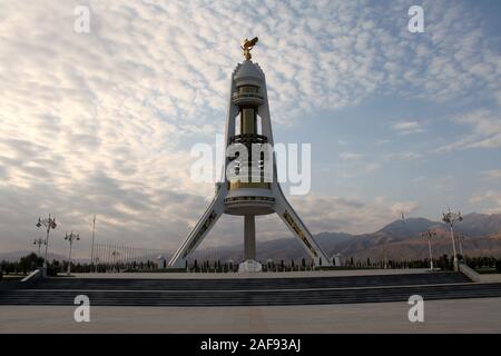 Arch of Neutrality in Ashgabat topped with a golden statue of former president Saparmurat Niyazov Stock Photo