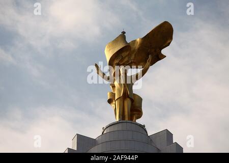 Arch of Neutrality in Ashgabat topped with a golden statue of former president Saparmurat Niyazov Stock Photo