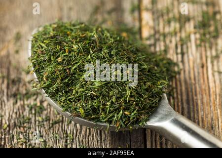 Dried Green Organic Dill Spice in a Bowl Stock Photo