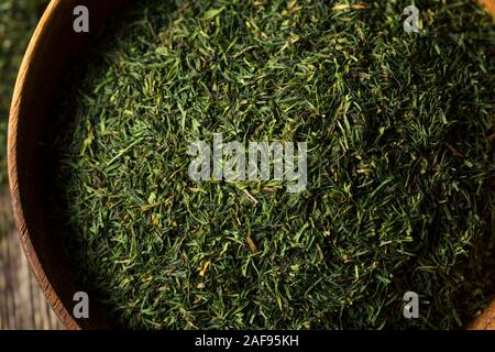Dried Green Organic Dill Spice in a Bowl Stock Photo
