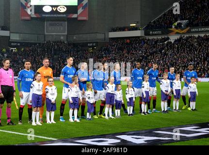 GLASGOW, SCOTLAND - DECEMBER 12: Rangers line up with mascots before the UEFA Europa League group G match between Rangers FC and BSC Young Boys at Ibrox Stadium on December 12, 2019 in Glasgow, United Kingdom. (Photo by MB Media) Stock Photo