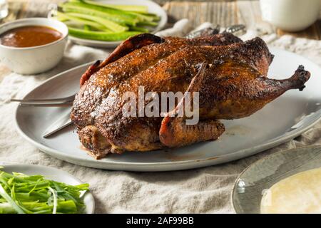 Homemade Roast Chinese Peking Duck with Cucumber and Scallions Stock Photo