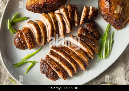 Homemade Roast Chinese Peking Duck with Cucumber and Scallions Stock Photo