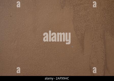 Texture of painted wall. Beige painted wall. Texture for designers brown or beige painted wall, putty Stock Photo