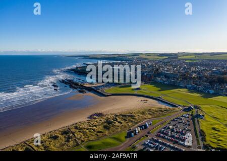 Aerial view of St Andrews from West Sands. The rocky coastline and the Old Course of St Andrews can both be seen in this stunning photo.