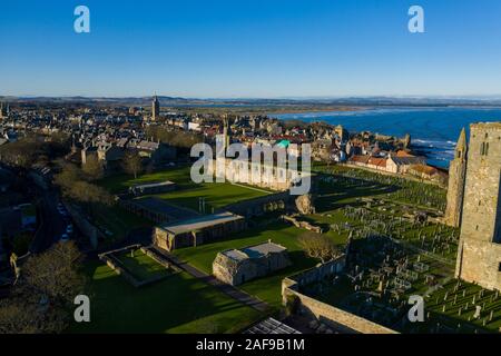 Unique Drone view of the ruins of the St Andrews Cathedral, Scotland with the dramatic coastline seen in the background. Stock Photo