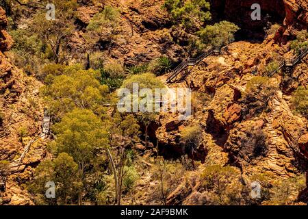 Stairs and ladders cross the gorge along the rim walk at Kings Canyon. Kings Canyon, Northern Territory, Australia Stock Photo