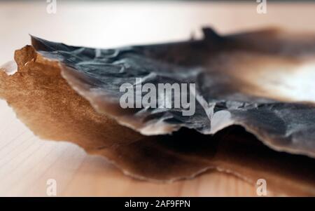 Burnt paper edges, blackened and crumpling Stock Photo