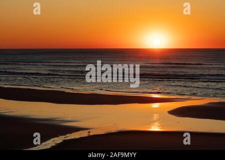 Golden sunset over the Pacific Ocean, Lincoln City, Oregon Stock Photo