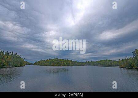 Storm Clouds Rolling Over the North Woods on Omega Lake in The Boundary Waters in Minnesota Stock Photo