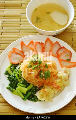 dried thin rice noodle topping barbecue pork and dumpling with soup Stock Photo