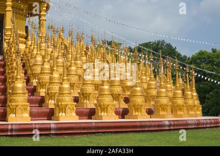 Many gold pagodas at Wat Pa Sawang Bun in Saraburi Province Thailand. There are 500 small pagodas decorated around big pagoda. Stock Photo
