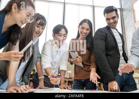 Group of Asian business people team meeting in modern office working design planning and ideas concept Stock Photo