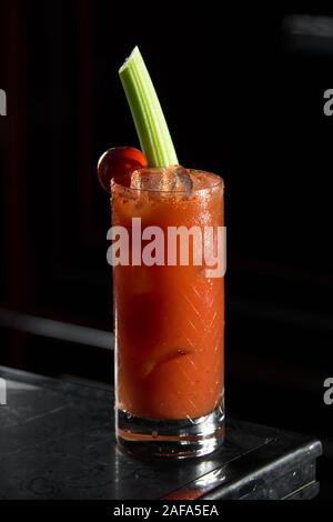 Bloody Mary on a bar desk. black background Stock Photo