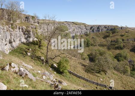 Malham Cove in Yorkshire Dales National Park is a dried up waterfall with a limsestone pavement above Stock Photo