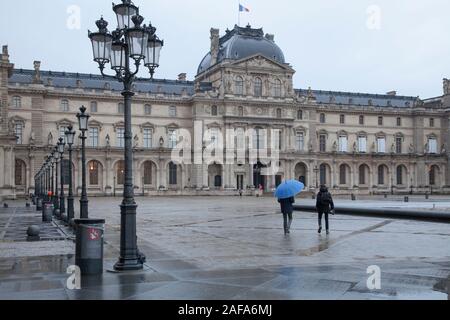 The Pavillon de l’Horloge is part of the Louvre Museum complex in Paris. Shown here early on a wet winter morning Stock Photo