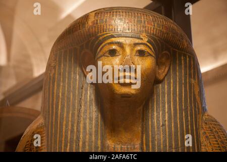 Face detail of a painted Egyptian sarcophagus in the Louvre Museum, Paris Stock Photo