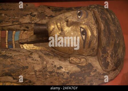 Face detail of a painted Egyptian sarcophagus in the Louvre Museum, Paris Stock Photo