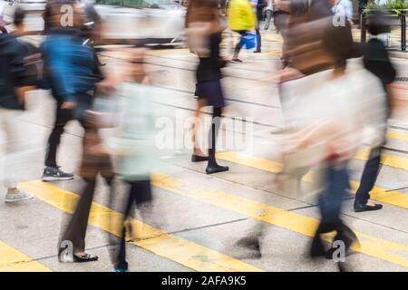 people crossing street on pedestrian crossing, abstract motion blur , HongKong - Stock Photo