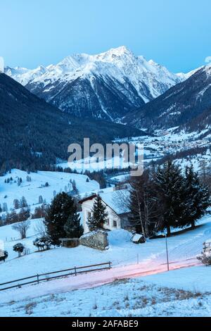 Landscape of the Engadine valley at dusk in winter,  Guarda, Lower Engadine, Graubunden, Switzerland. Stock Photo