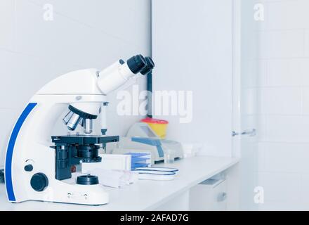Close up of high quality microscope on table Stock Photo