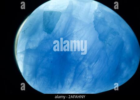 Blue Calcite Crystal. CaCO3, Backlit. Macro Geology Photo. UK. Stock Photo