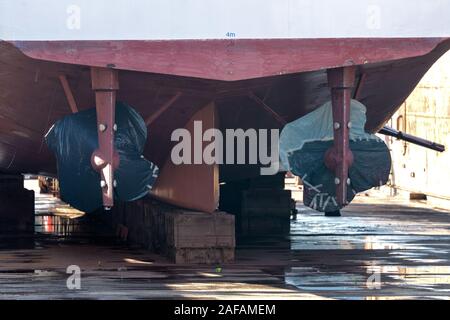 propeller and rudder of a ship in dockyard Stock Photo