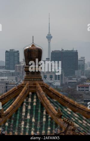 Views of a traditional roof and the CCTV (Central China Television) tower. Beijing, China Stock Photo