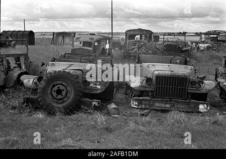 Second World War WW2 army military vehicles and  cars dumped in French landscape.1960s Normandy France. 1967 HOMER SYKES Stock Photo