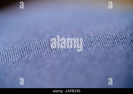 Macro shot of the textile garmet - thin exclusive blue color thin knitted fabric Stock Photo