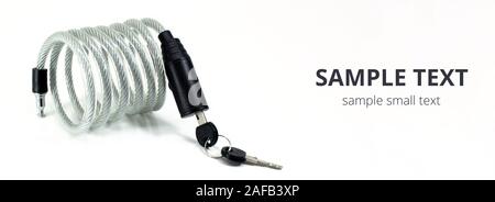 Silver bicycle lock for bike with key isolated on white background. Wide mockup for copy space. Stock Photo