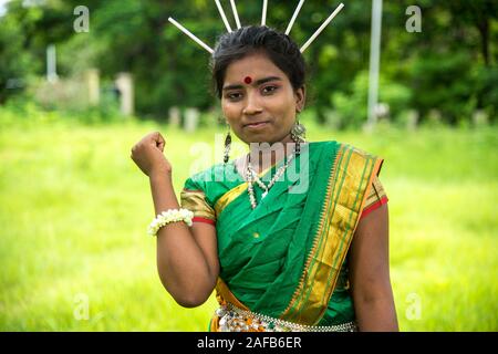 AMRAVATI, MAHARASHTRA, INDIA - AUGUST 9 : Group of Gondi tribes celebrating world tribal day by performing folk Dance in Amravati, Maharashtra, India Stock Photo