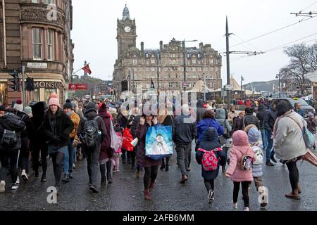 Princes Street, Edinburgh, Scotland, UK. 14th Dec, 2019. Christmas shoppers and tourists braved the blustery wind with heavy showers and occasional sunshine in the city centre and Christmas Market on this second last Saturday before the big day. Stock Photo