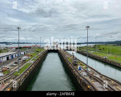Panama - 11/6/19: A container ship entering the first lock in the Panama Canal. Stock Photo