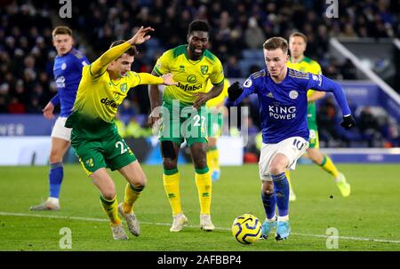 Leicester City's James Maddison (right) and Norwich City's Kenny McLean (left) and Alexander Tettey battle for the ball during the Premier League match at King Power Stadium, Leicester. Stock Photo