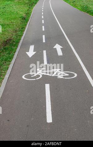 bike lane signal, painted white on asphalt road Stock Photo