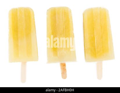 Homemade Pineapple Popsicles isolated on white background (close-up shot) Stock Photo