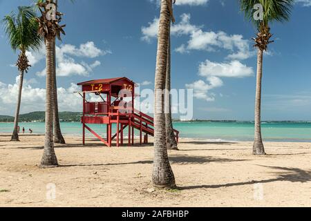 Lifeguard house and palm trees, Luquillo Beach, Luquillo, Puerto Rico Stock Photo