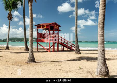 Lifeguard house and palm trees, Luquillo Beach, Luquillo, Puerto Rico Stock Photo