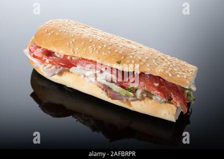 Beautiful baguette sandwich isolated on dark background Stock Photo