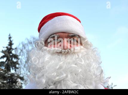 Cherkasy, Ukraine,December,24, 2011: Santa Claus    took part in New year show in the city square near the Christmas tree Stock Photo