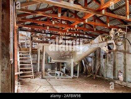 The old equipment to process cinnabar ore is still visible with a view of the inside of the main processing building of the Blue Ridge Mine in the Och Stock Photo