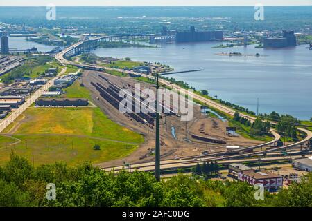 John A. Blatnik Bridge I-535 Saint Louis River Highway Crossing Duluth, MN with rail yard in foreground Stock Photo