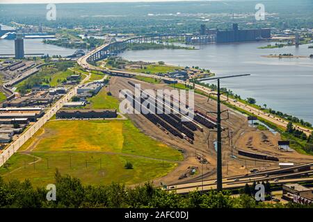 John A. Blatnik Bridge I-535 Saint Louis River Highway Crossing Duluth, MN with rail yard in foreground Stock Photo