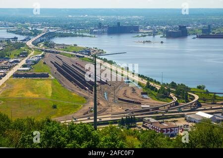 John A. Blatnik Bridge I-535 Saint Louis River Highway Crossing Duluth, MN with rail yard in foreground Stock Photo