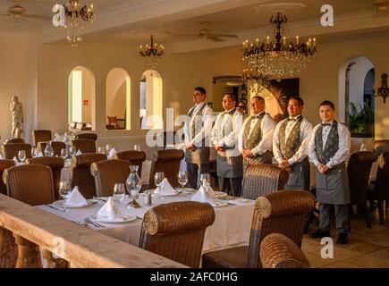 Iguana Restaurant wait staff ready for dinner guests at Casa Kimberly, Puerto Vallarta, Jalisco, Mexico. Stock Photo