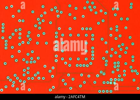 a back side of lush lava color curcuit board flat background without any components. Stock Photo