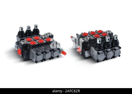 Three section Hydraulic distributor of the tractor on isolated white background with shadow Stock Photo
