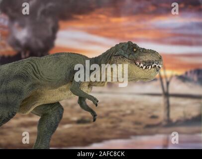 Portrait of walking and dangerous tyrannosaurus rex with erupting volcano in the background. Stock Photo