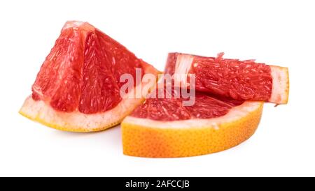 Portion of chopped Grapefruits isolated on white background (close-up shot) Stock Photo